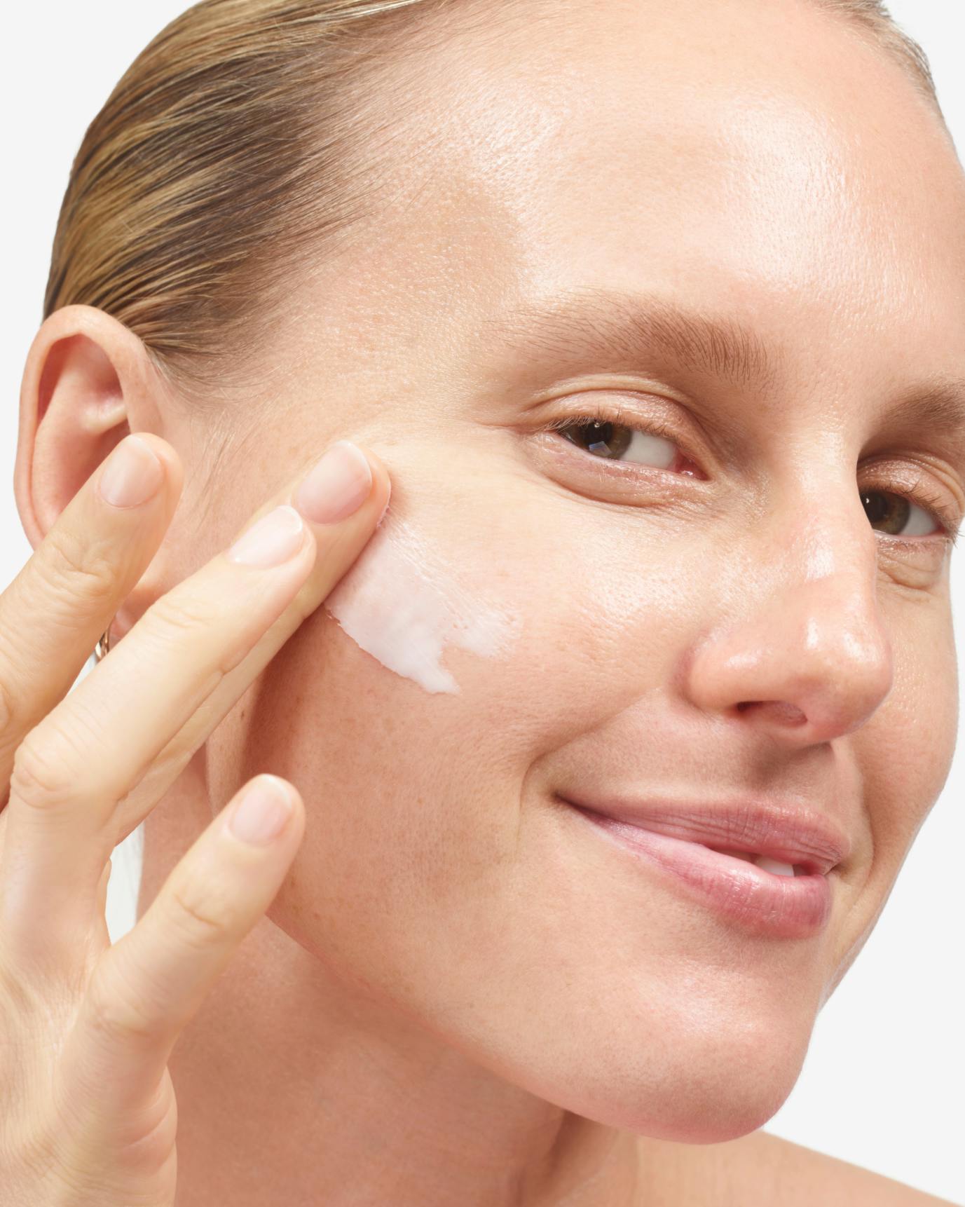 Elly moisturizes with After Baume.