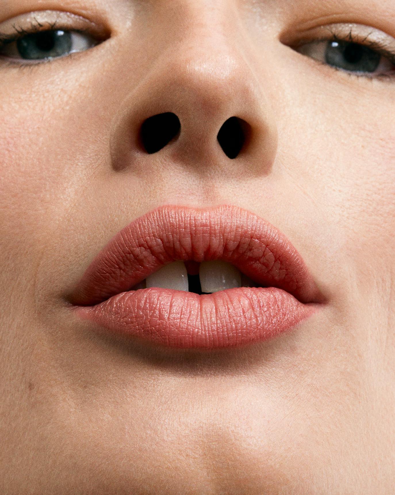 Luna wears Lip Line in Graze.