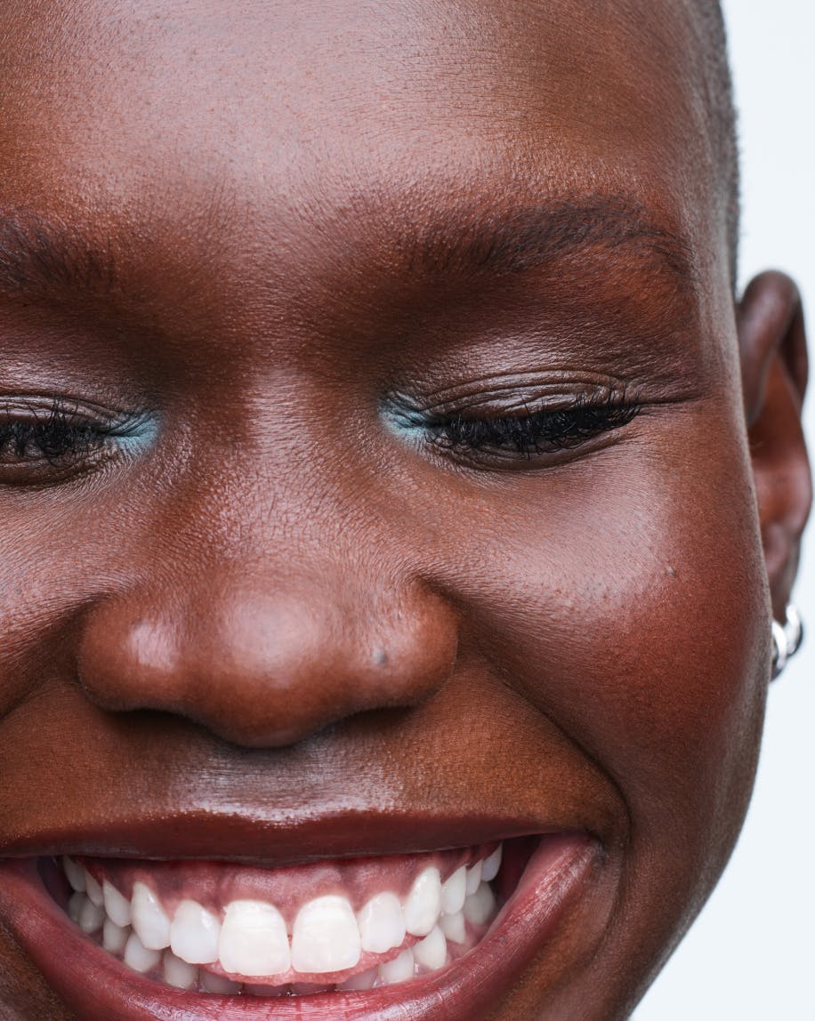 Adot highlights the inner corners of her eyes in Patina.